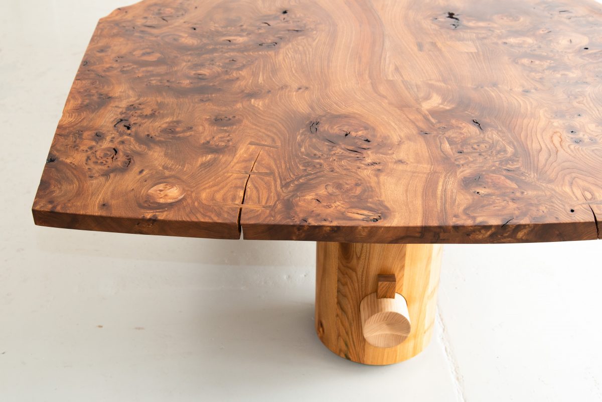Nakashima-inspired, 12 seater table, made from highly figured Scottish Elm. Inlaid geometric pieces are used to replace surface defects. Hand carved pin-striping and profiling