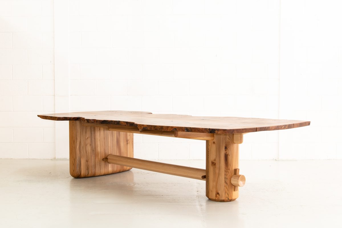 Nakashima-inspired, 12 seater table, made from highly figured Scottish Elm. Inlaid geometric pieces are used to replace surface defects. Hand carved pin-striping and profiling