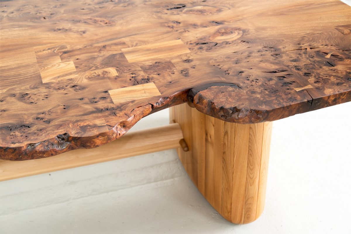 Nakashima-inspired, 12 seater table, made from highly figured Scottish Elm. Inlaid geometric pieces are used to replace surface defects. Hand carved pin-striping and profiling