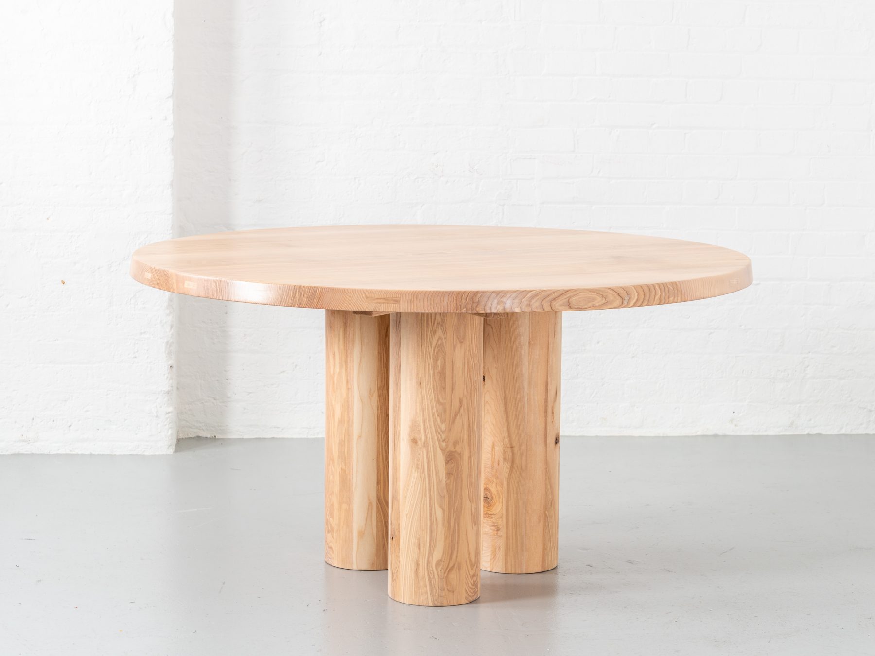 Medium Pier round table made from either Scottish Elm or British Oak, 3 staved round legs supported by an all timber frame, table top constructed with loose tongue joinery