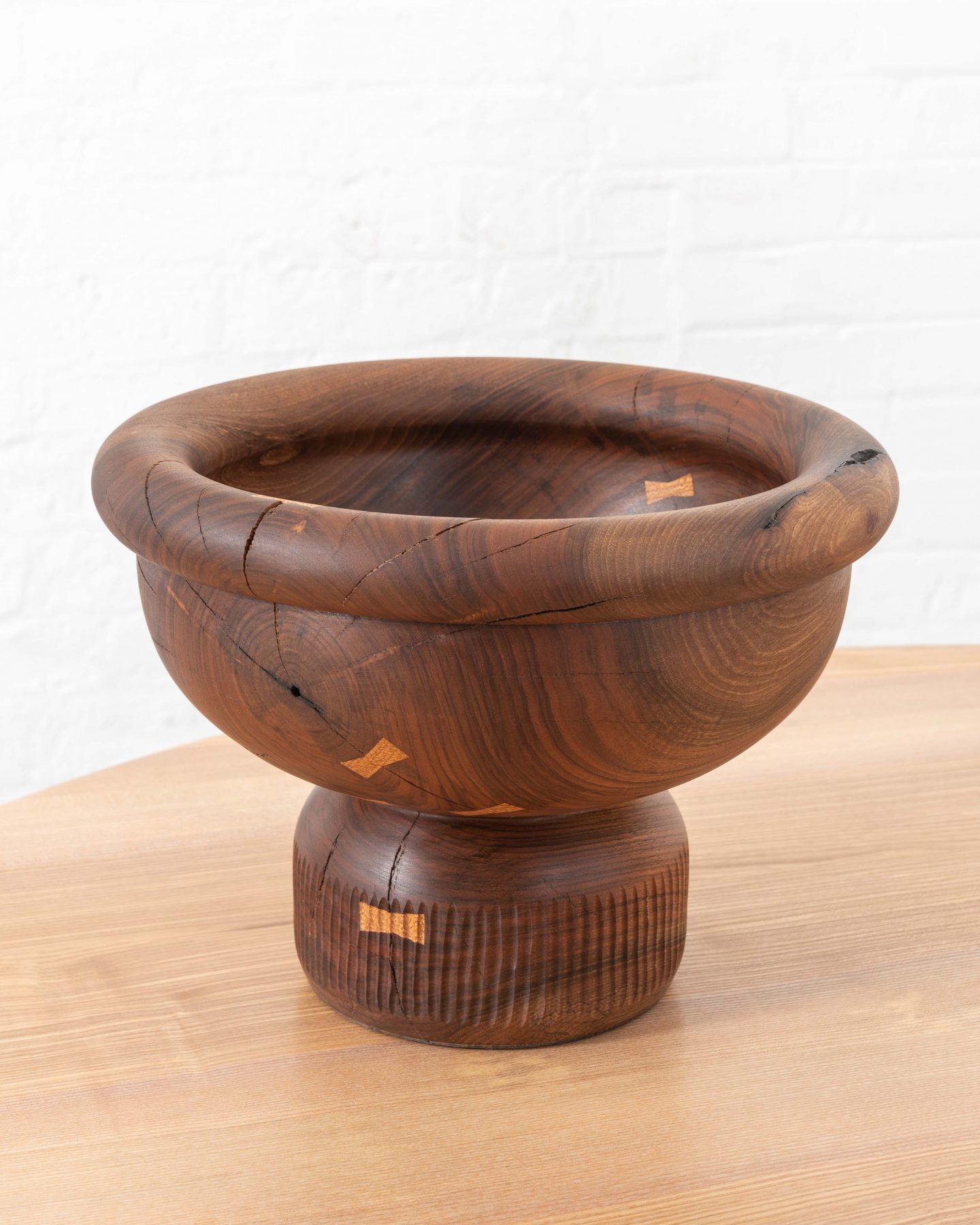 One Legger, Turned and hand carved vessel from a single piece of English walnut. rare timber comes from Dog kennel hill, Camberwell, London. Elm dovetail keys have been utilised to tie the object together.