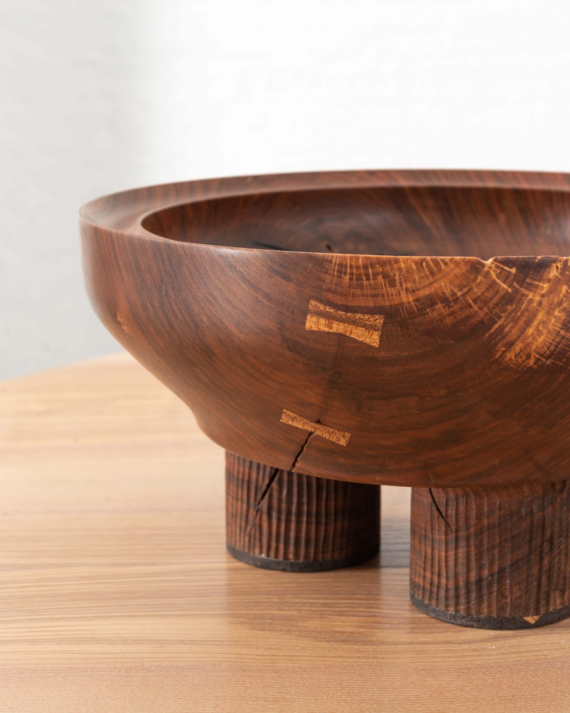 Three Legger, Turned and hand carved vessel from a single piece of English walnut. rare timber comes from Dog kennel hill, Camberwell, London. Elm dovetail keys have been utilised to tie the object together.
