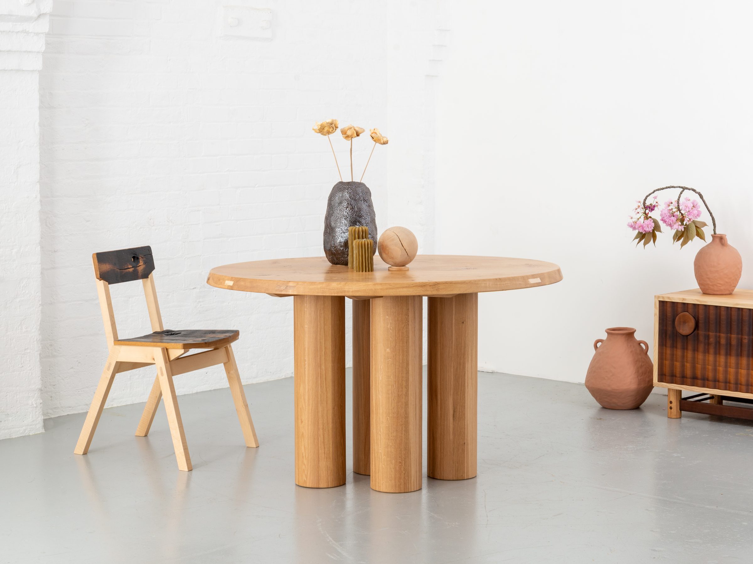 Pier Oval dining table made with a pippy oak table top and stave oak legs, seats 4 people