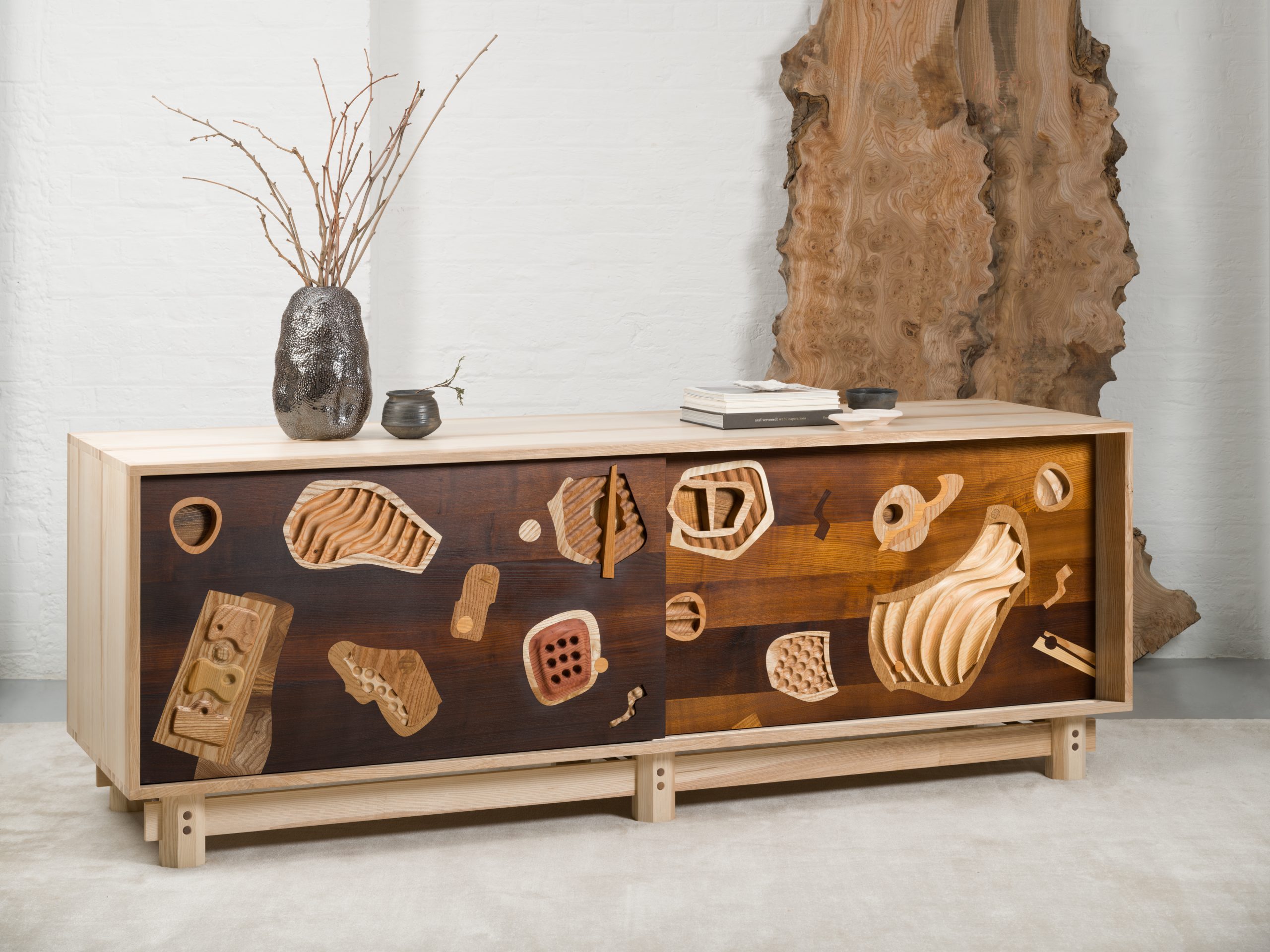 Discover 'What Lies Beneath'—a premium collection of bespoke furniture by London designer Jan Hendzel, blending hand-carved marquetry with fine British timber